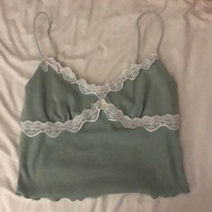 Green tank top with floral pattern.